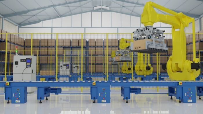 giant yellow robotic arm placing machine components on conveyor
