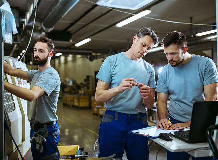 Engineer and workers doing their quality control in factory