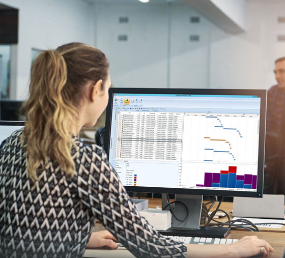 office worker checking schedule for production