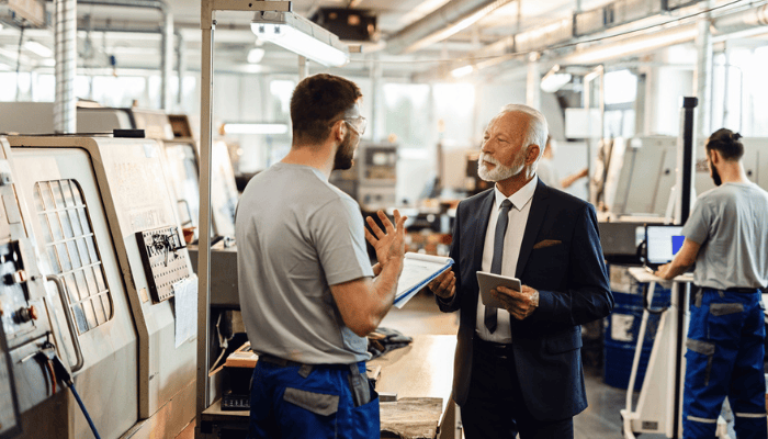Two manufacturers working on the shop floor